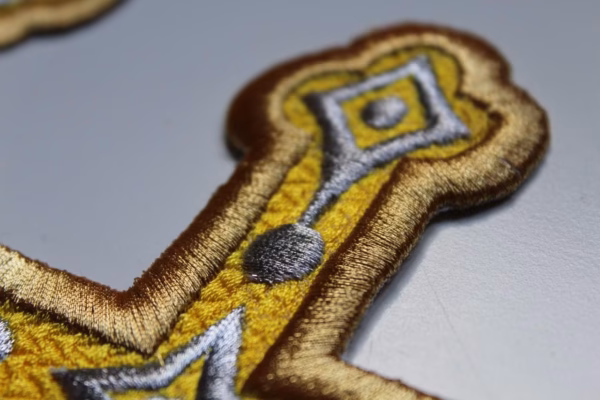 A close up a golden cross applique which shows the the quality and detail of our Orthodox embroidery.