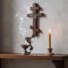 cedar-incense-in-use-5 A shot of a dark bronze katzion gently smoking, censing a wooden cross in a candlelit prayer corner.