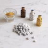marie-antoinette-incense-inspiration-5 An elegant flat-lay showing the origins of Marie Antoinette incense: frankincense powder, our signature mix of essences, and the finished incense.