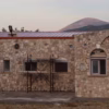A serene view of the St. John of the Ladder monastery in Greece, where your Orthodox donation directly supports our daily life and prayers.