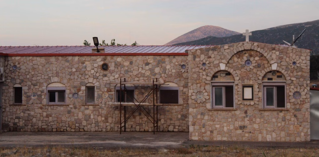 A serene view of the St. John of the Ladder monastery in Greece, where your Orthodox donation directly supports our daily life and prayers.
