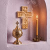 parma-lilac-incense-in-use Parma Lilac Athonite Incense burning in front of an ornate wall cross next to a lit beeswax taper.