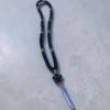 Black 100-knot satin komboksini with violet-pearl colored beads and a violet tassel.