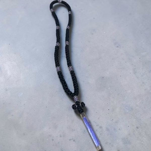 Black 100-knot satin komboksini with violet-pearl colored beads and a violet tassel.